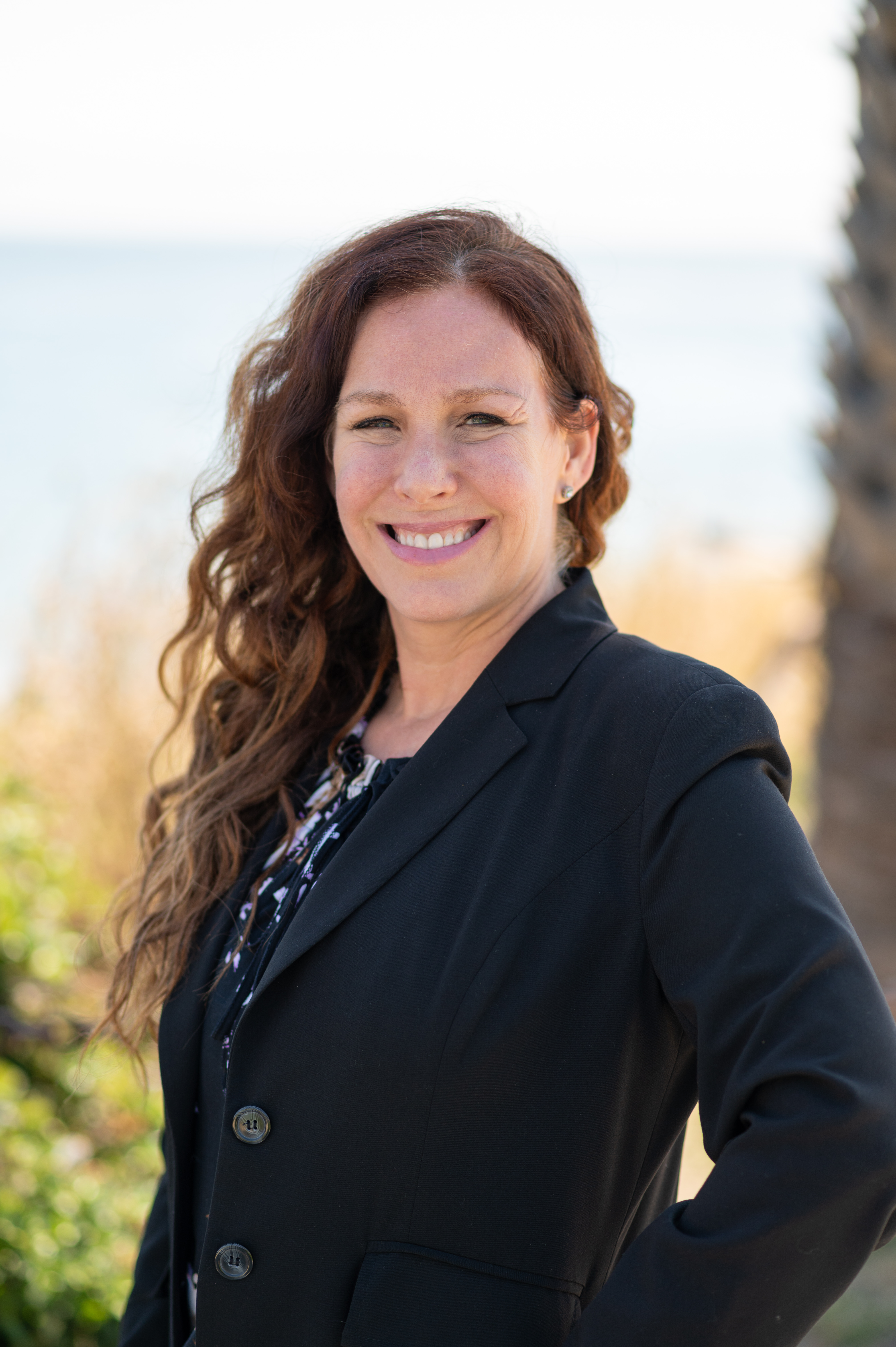 Amanda Barber smiling outdoors at Shell Beach